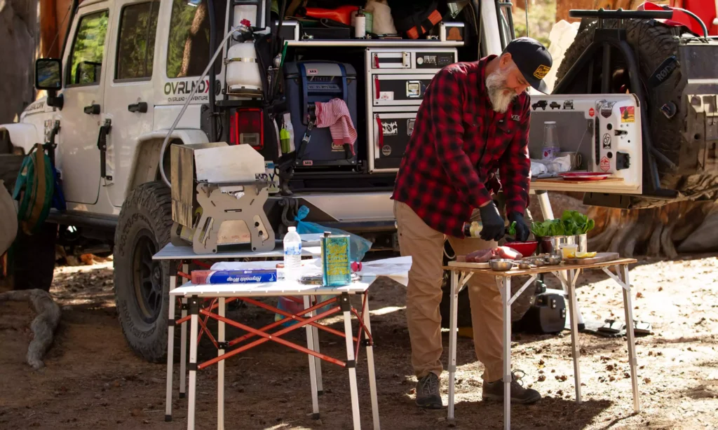 Marco Hernandez @ovrlndx Preparing a Meal Outdoors in His Camping Setup at the Campsite